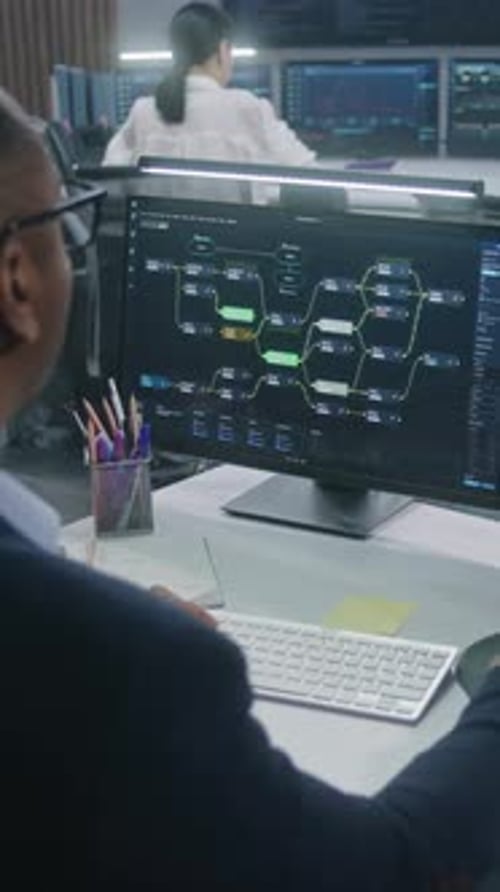 African American Scientist Works at Computer