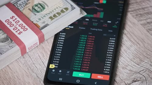 Ethereum Cryptocurrency Prices on a Smartphone Screen on a Table with Dollars