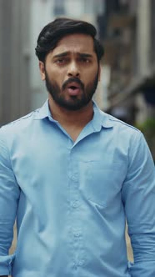 Portrait of Indian Man Says No Raising Crossed Hands on Street Vertical Shot