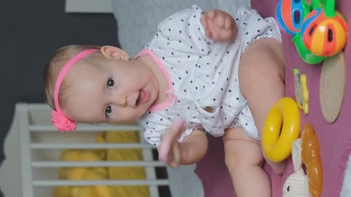 Cute Baby Girl Playing Teething Toy