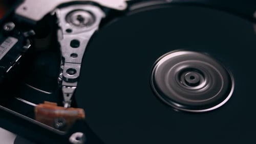 Macro Close Up of Working Opened Hdd Drive Hard Disk Move of Writing Reading Magnetic Head