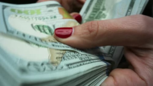 Businesswoman Hands Recounting American Paper Currency. Female Hands Holding 100 Dollar Banknotes