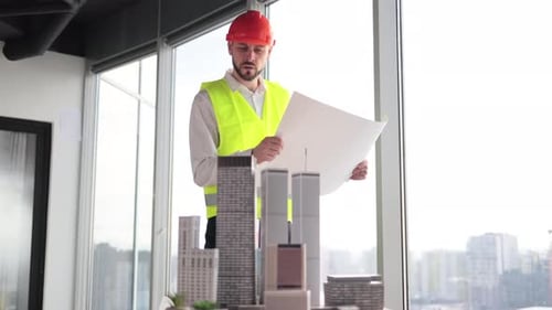 Engineer Man Holding Blueprint Standing Near Architecture Design of City