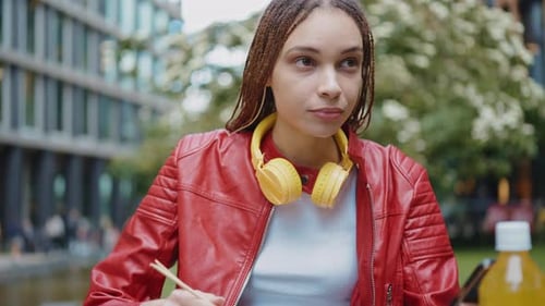 Young woman eating and spending time outside the office