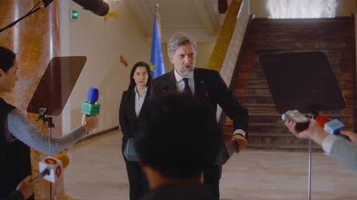 Mature EU Representative Comes to Press Conference