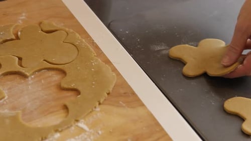 Placing Gingerbread Cookies on Cookie Sheet Baking
