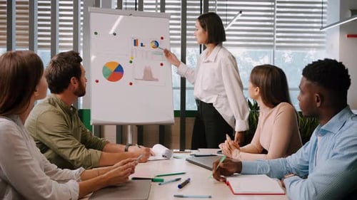 Asian Businesswoman Gives Presentation at Conference