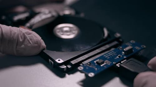 Macro Close Up of Working Opened Hdd Drive Hard Disk Move of Writing Reading Magnetic Head