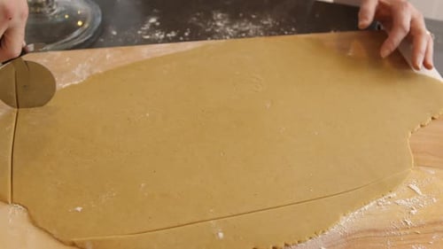 Cutting Dough for Gingerbread House Baking