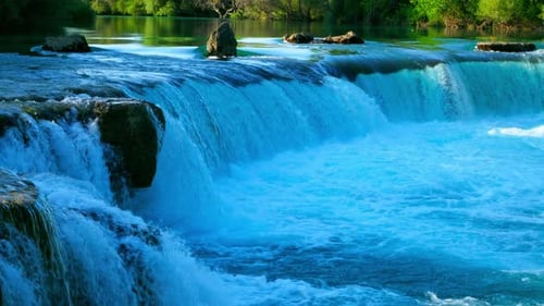 Rocks And Flowing Small Waterfall