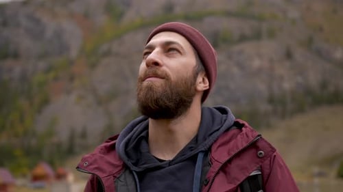 Traveler Guy Stands in Picturesque Place of Wildlife