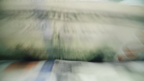 Close Up of Bill Counter Counting Hundred Dollar Bills for Currency Exchange