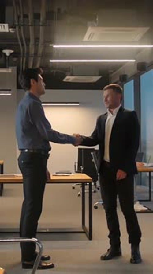 Vertical of Two Businesspeople Shaking Hands