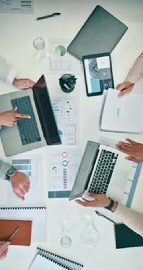 Business people, meeting and finance documents by laptop for analytics, planning