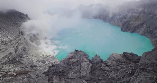 Beautiful Crater Lake on Mount Ijen Volcano, Java, Indonesia - Aerial