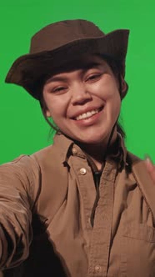 Young Female Hiker Posing for Selfie on Chroma Key Background