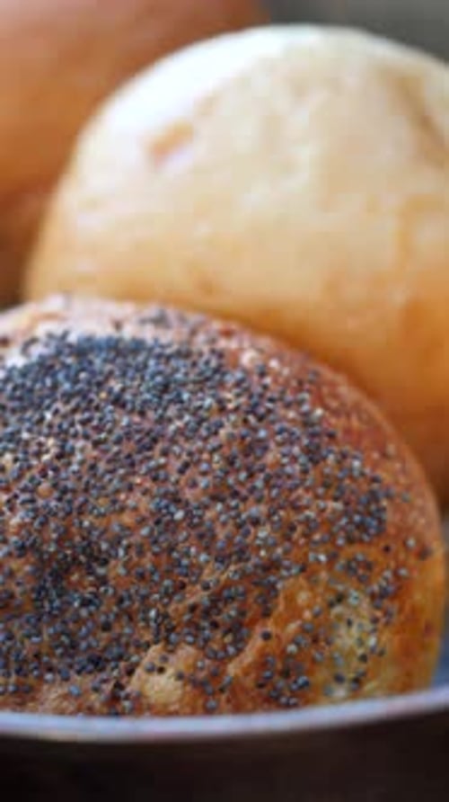 A Variety of Freshly Baked Bread Rolls Displayed Beautifully in a Charming Rustic Setting