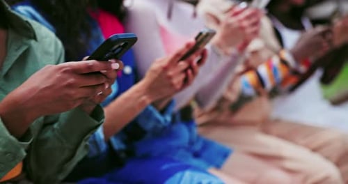 Hands, phone or group of friends in city on social media to chat on internet post