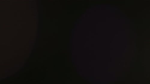 Abstract Overlay with Close Up Sunrise Light Transition Lens Flare Flashes Effects on Dark