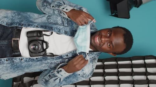 Vertical Video Male Model Posing with Photography Backstage Equipment
