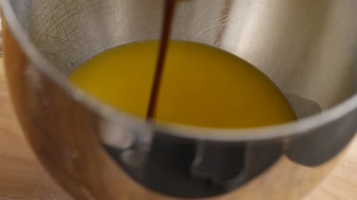 Pouring Molasses Into Mixing Bowl Baking