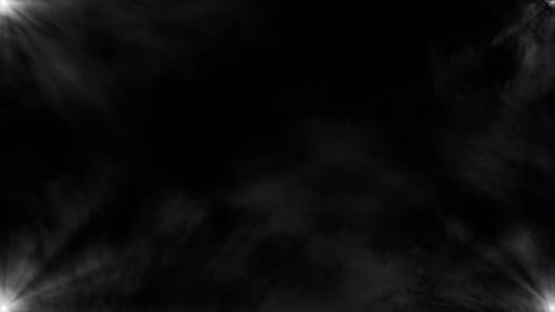 Spot light at the edges of the frame. White rays of light on a black background glow in the center