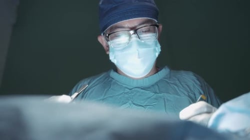 A doctor doing surgery in the operating room