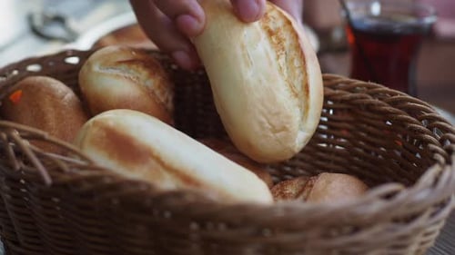 Delicious Freshly Baked Bread Rolls Arranged Neatly in a Rustic Basket for Enjoyment