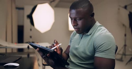 Man, tablet and digital sketch in studio for work as graphic designer or edit picture for agency