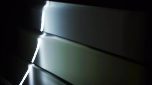 A Bright Glowing Light Flashed On The Black Background Glass Panels. Abstract Overlay Filter