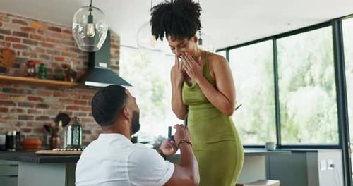 Man, woman and proposal with ring in home for love, romance and surprise for progress