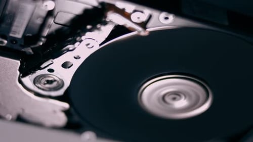 Macro Close Up of Working Opened Hdd Drive Hard Disk Move of Writing Reading Magnetic Head