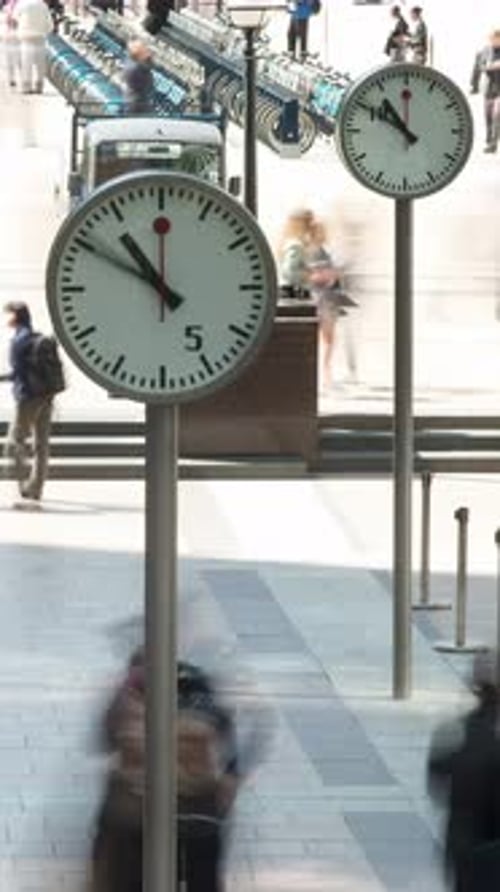 Clocks in Canary Wharf London Docklands Vertical