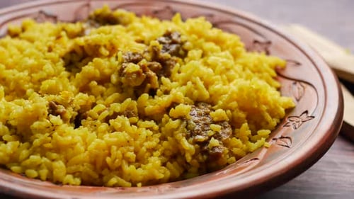 Boiled Yellow Rice with Meats on a Plate