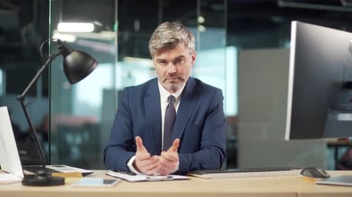 bearded man listen online seminar, meeting, conference or lecture, looking at camera remotely.