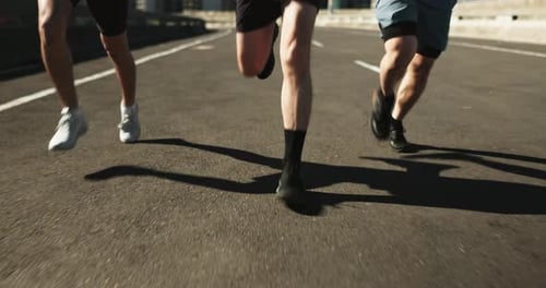 Fitness, legs and people running for exercise, cardio and health on road with workout and training