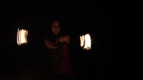 Fire Show A Professional Woman Performing a Fiery Trick with a Burning Rope