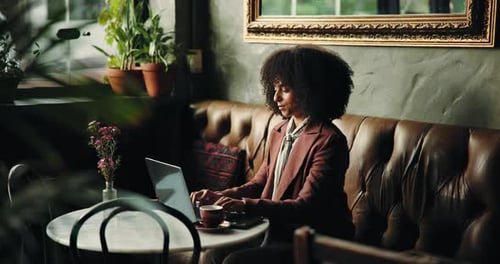 Typing, laptop and business with woman in cafe for remote work, restaurant branding and research