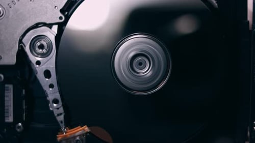 Macro Close Up of Working Opened Hdd Drive Hard Disk Move of Writing Reading Magnetic Head