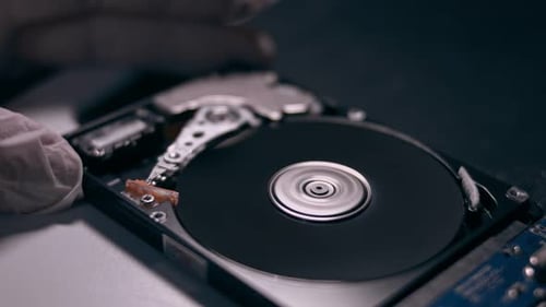 Macro Close Up of Working Opened Hdd Drive Hard Disk Move of Writing Reading Magnetic Head