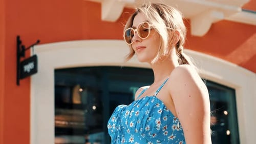 Beautiful blond woman posing outdoors