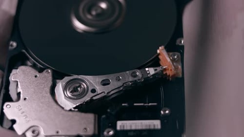 Macro Close Up of Working Opened Hdd Drive Hard Disk Move of Writing Reading Magnetic Head