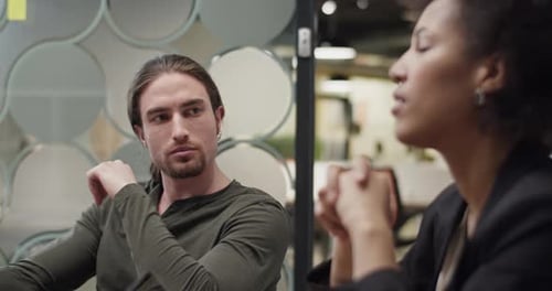 Man Listening to Boss During Meeting