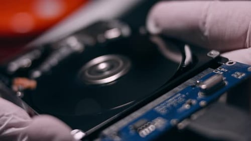 Macro Close Up of Working Opened Hdd Drive Hard Disk Move of Writing Reading Magnetic Head