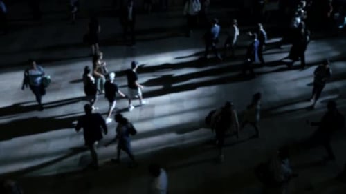 crowd of people walking on busy street at rush hour time