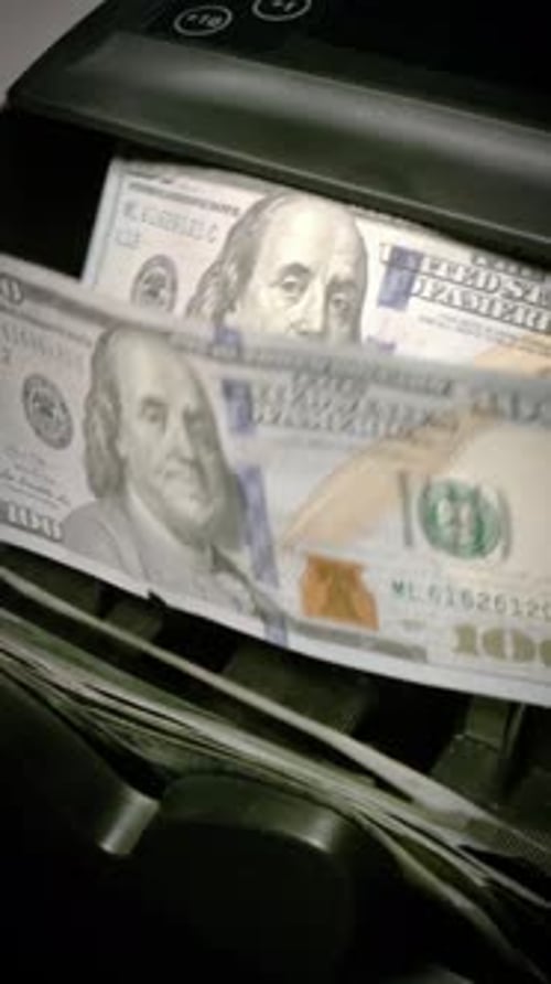 Money counting machine. Slow Motion. Vertical Video.