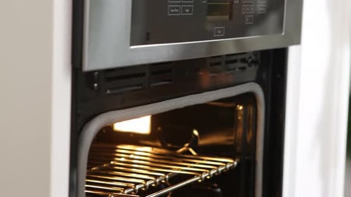Putting Gingerbread Cookies Into Oven Baking
