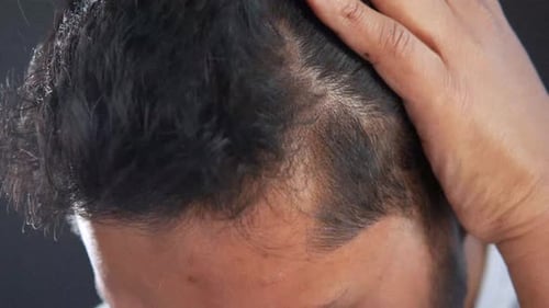 Young Man with Styling Hair Close Up