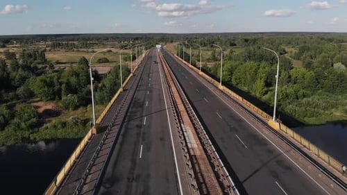 Bird's Eye View of the Road Bridge Across the River and Residential and Industrial Buildings