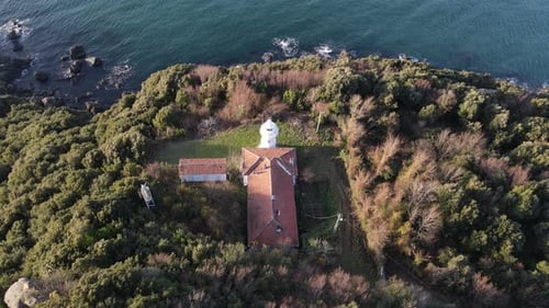 Aerial Lighthouse Across Sea